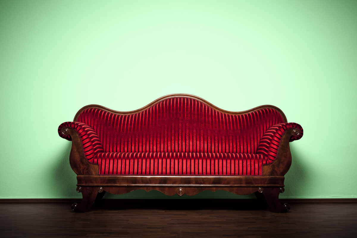 Photography of a restored Art Nouveau sofa.